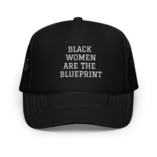 Load image into Gallery viewer, Black trucker hat with "Black Women Are the Blueprint" embroidered in white letters