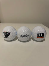 Load image into Gallery viewer, Three golf balls with Howard University logos on a plain background
